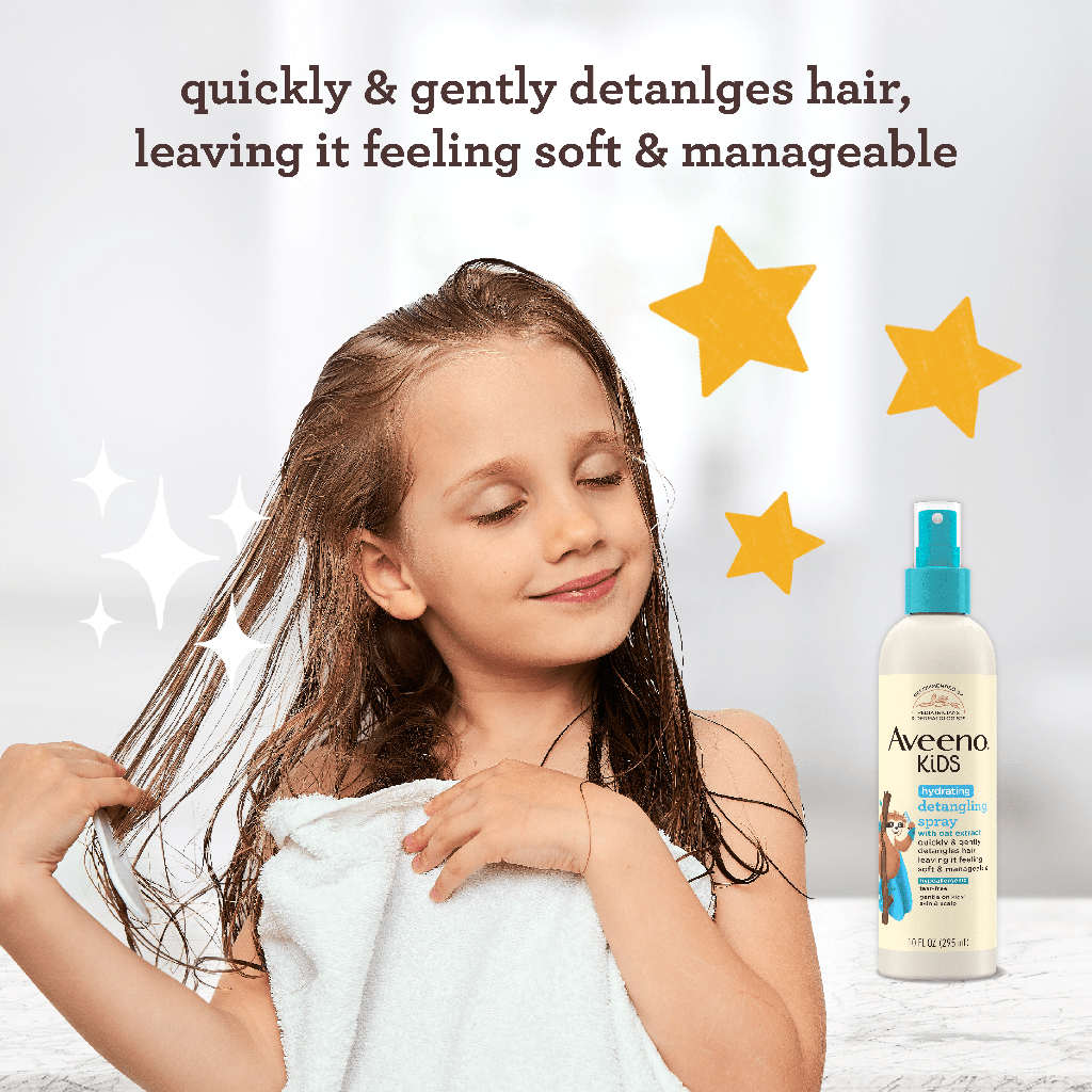 Child drying hair with a towel next to Aveeno Kids Detangling Spray