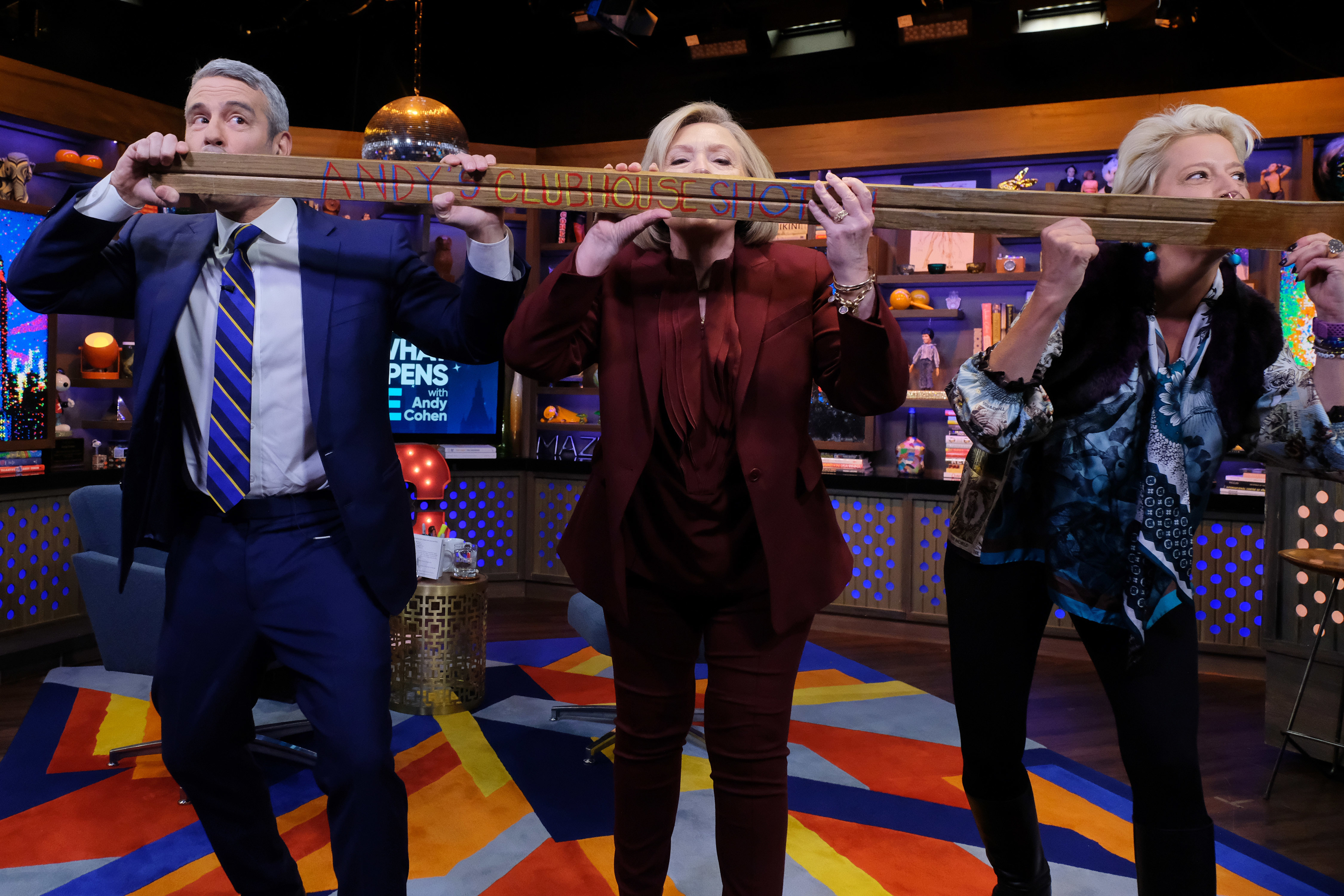 Andy Cohen, Martha Stewart, and another person perform a drinking skit on "Andy Cohen's Watch What Happens Live" set