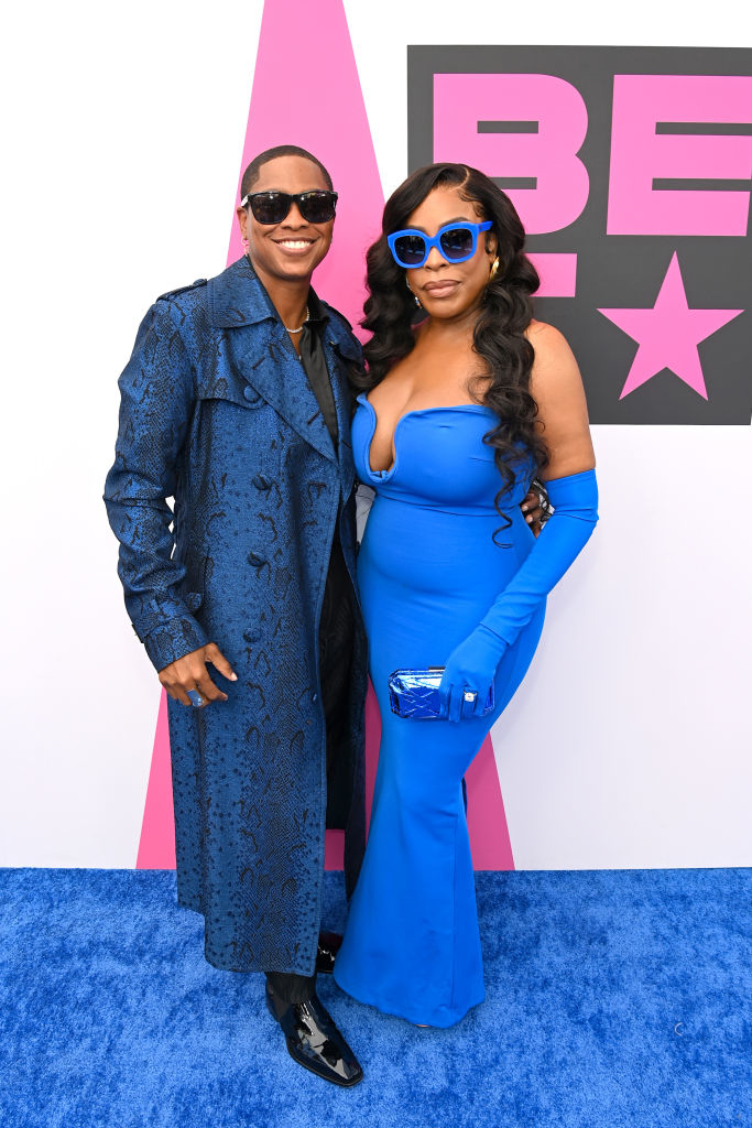 Niecy Nash and Jessica Betts at the BET Awards, with Jessica in a blue coat and sunglasses, and Niecy in an off-shoulder gown holding a clutch
