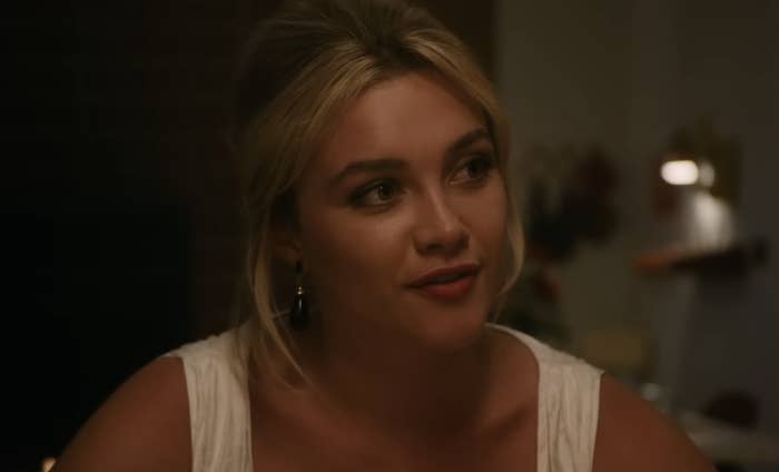Florence Pugh in a YouTube clip from "Don't Worry Darling" titled "Dinner." The webpage shows related video thumbnails on the right