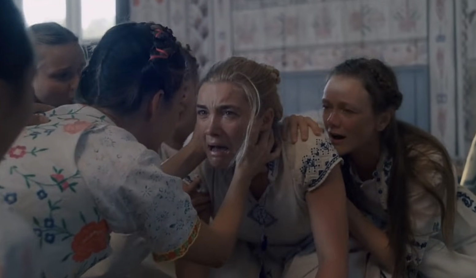 A YouTube video titled "Midsommar (2019) | Dani's Crying Scene (HD)" shows Florence Pugh crying while multiple women in traditional clothing console her