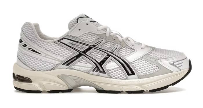 ASICS running shoe with a mesh upper and curved lines design, featuring a cushioned sole