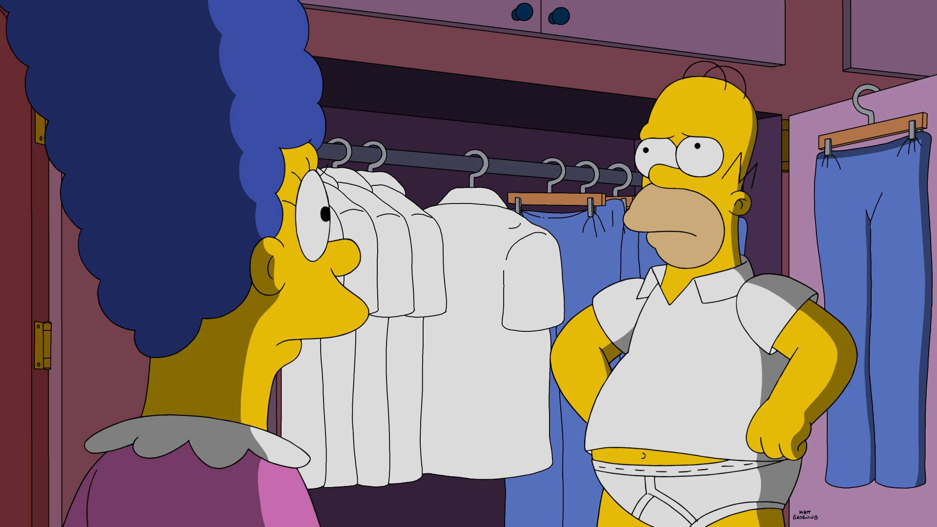 Homer Simpson, in his underwear, stands with hands on hips looking at Marge Simpson. They are in a wardrobe with shirts and pants hanging