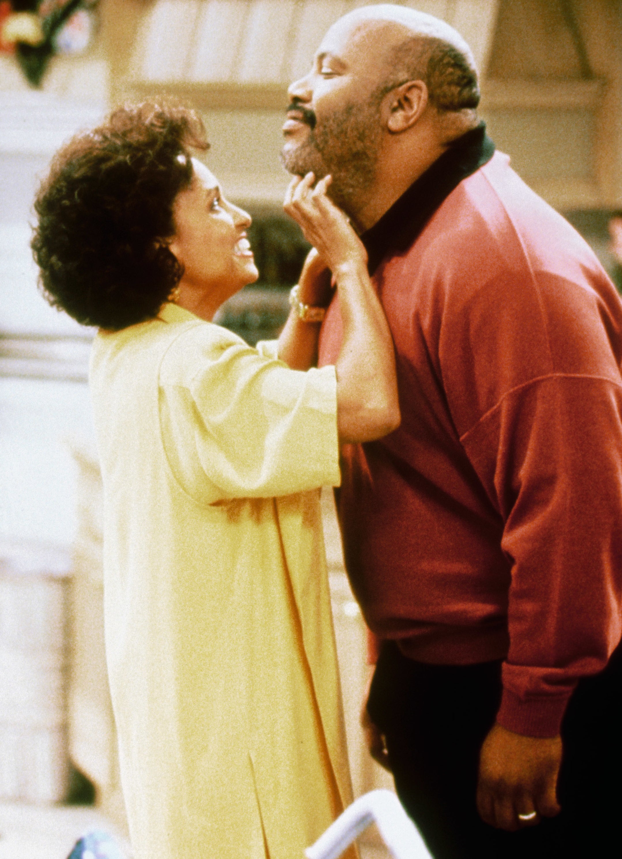 Daphne Maxwell Reid playfully holds James Avery&#x27;s face in a scene from &quot;The Fresh Prince of Bel-Air&quot;