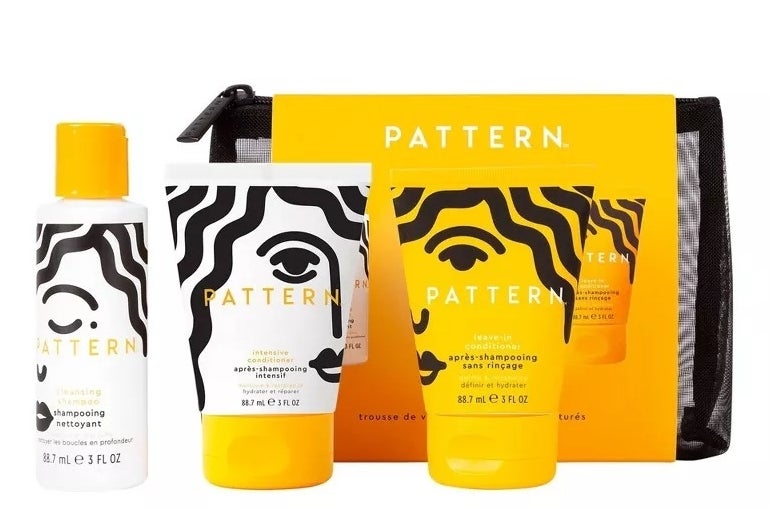 Pattern hair care set with shampoo, conditioner, and a small pouch in bright packaging, featuring a stylized face design