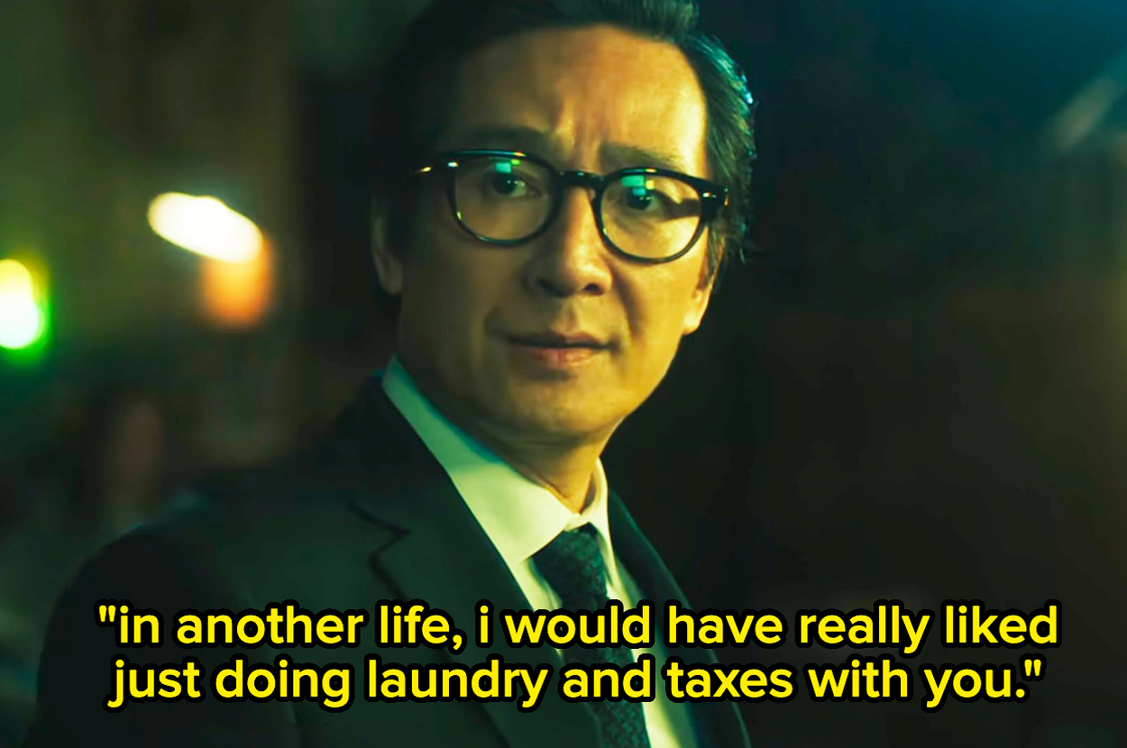 Ke Huy Quan in a suit and tie, wearing glasses, with the quote: 