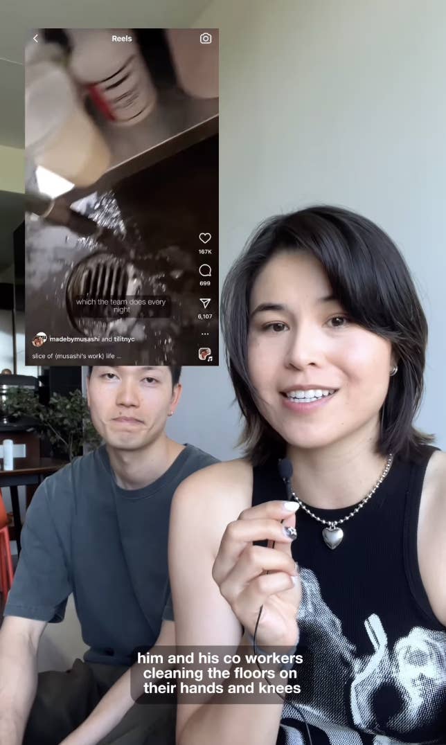 Man and woman smile at the camera while seated indoors. Text on video behind them reads: "which tile he scrubs every seven days."