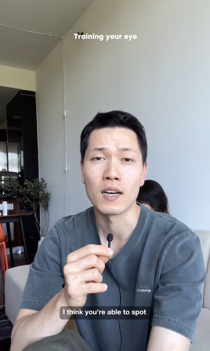 Young man holding a microphone, talking to the camera in a living room. Partial text reads "Training your eye" and "I think you're able to spot"