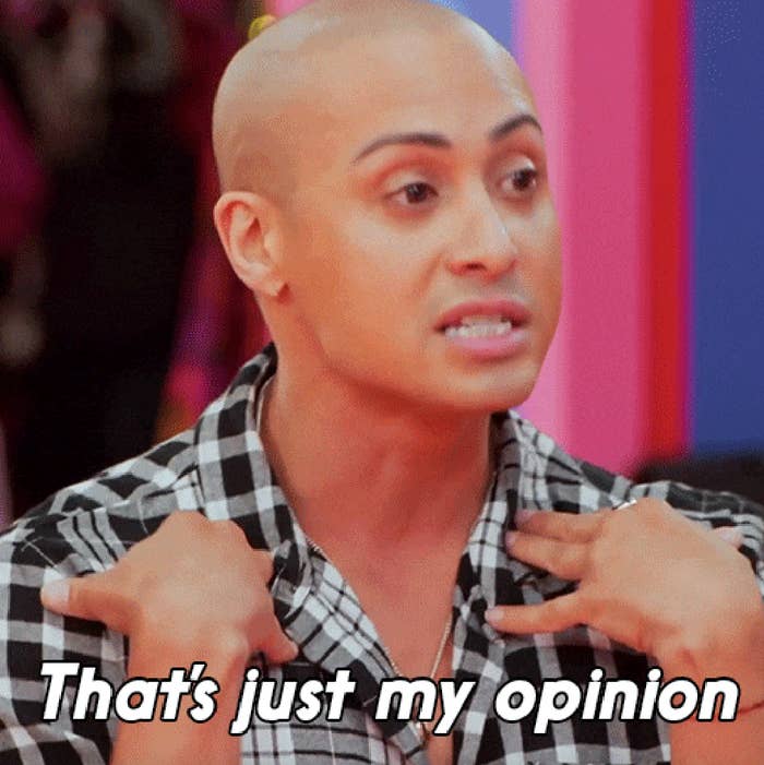 A person with a shaved head and checkered shirt gestures with their hands, accompanied by the text &quot;That's just my opinion.&quot;