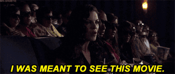 Scene in a theater with people wearing 3D glasses. Foreground character exclaims, "I was meant to see this movie."