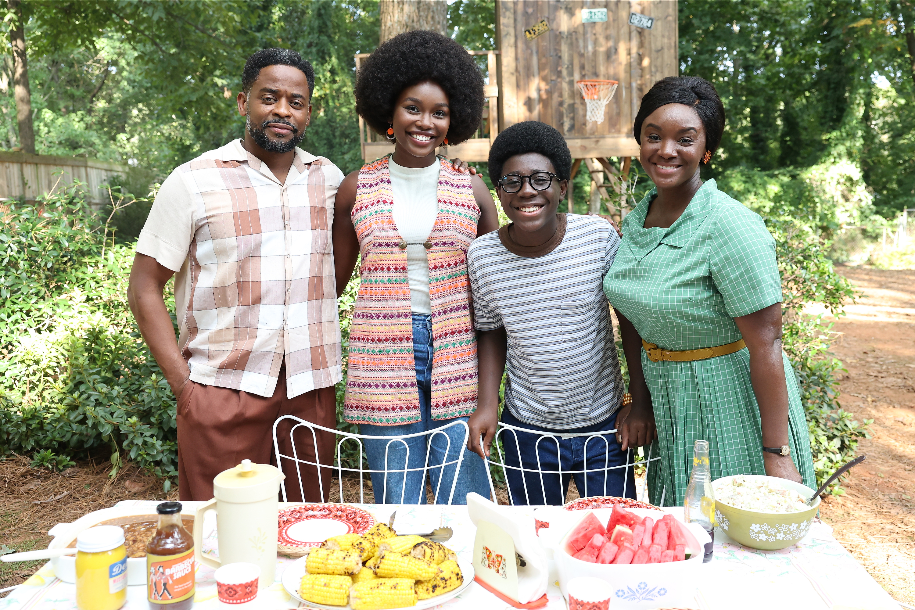 The cast of &quot;The Wonder Years&quot; stand together behind an outdoor table set with food