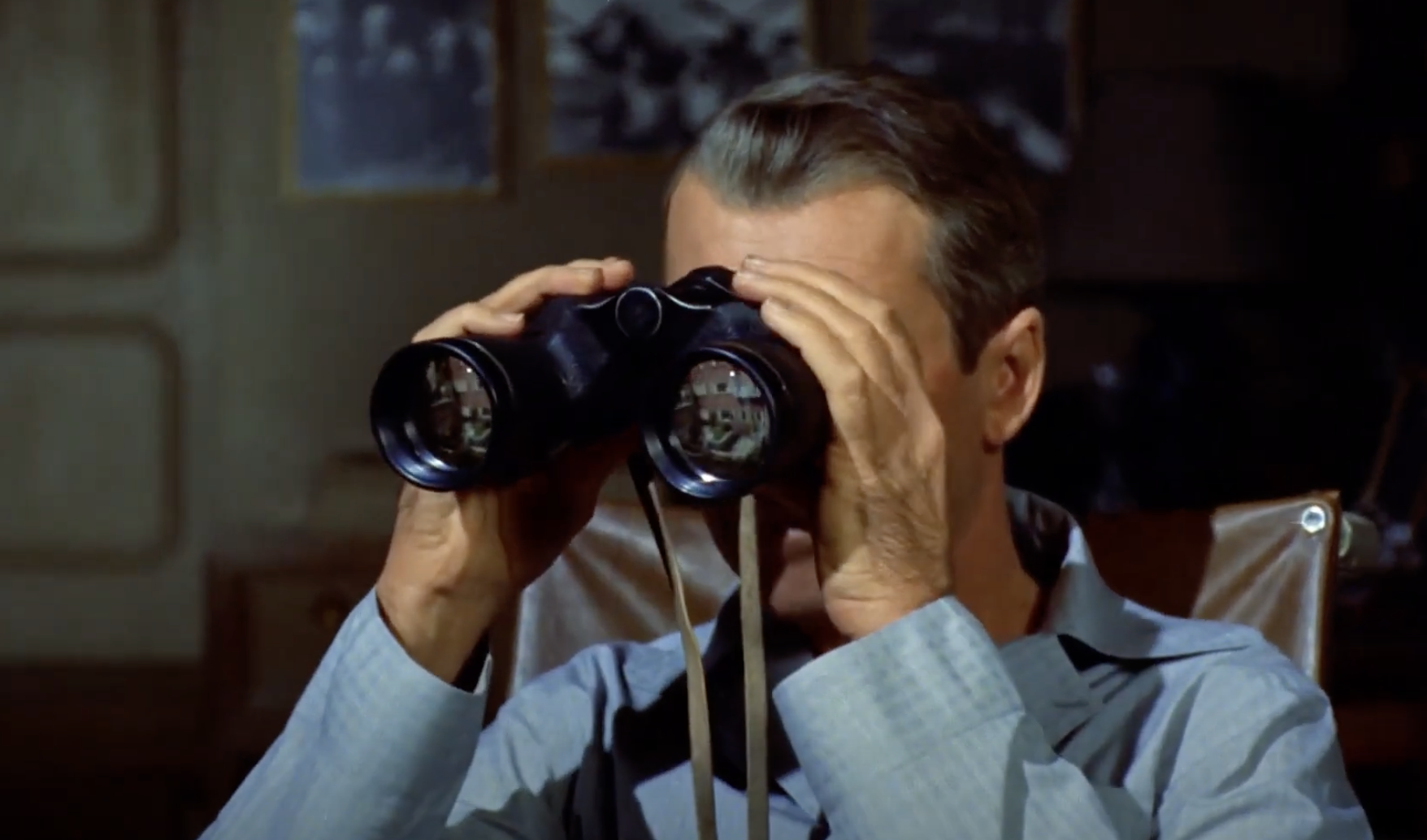 James Stewart looks through binoculars in a scene from the movie "Rear Window."
