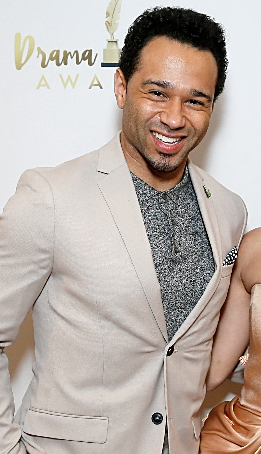 Corbin Bleu smiles in a light-colored suit at the Drama Awards