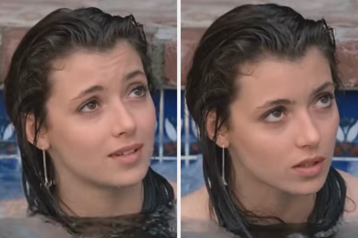 Mia Sara as Sloane in Ferris Bueller's Day Off with wet hair in a pool, looking upward with a calm expression. She wears hoop earrings. No text present