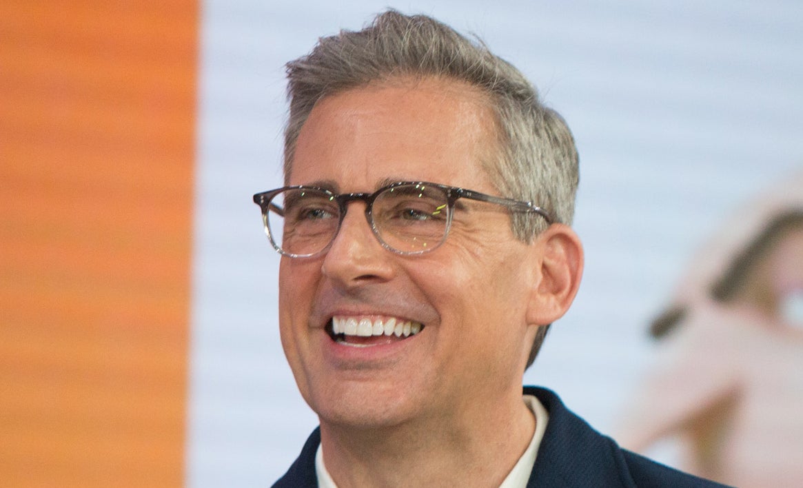 Steve Carell and Kristen Wiig are laughing while holding 'Today Show' mugs, with an animated character in the background