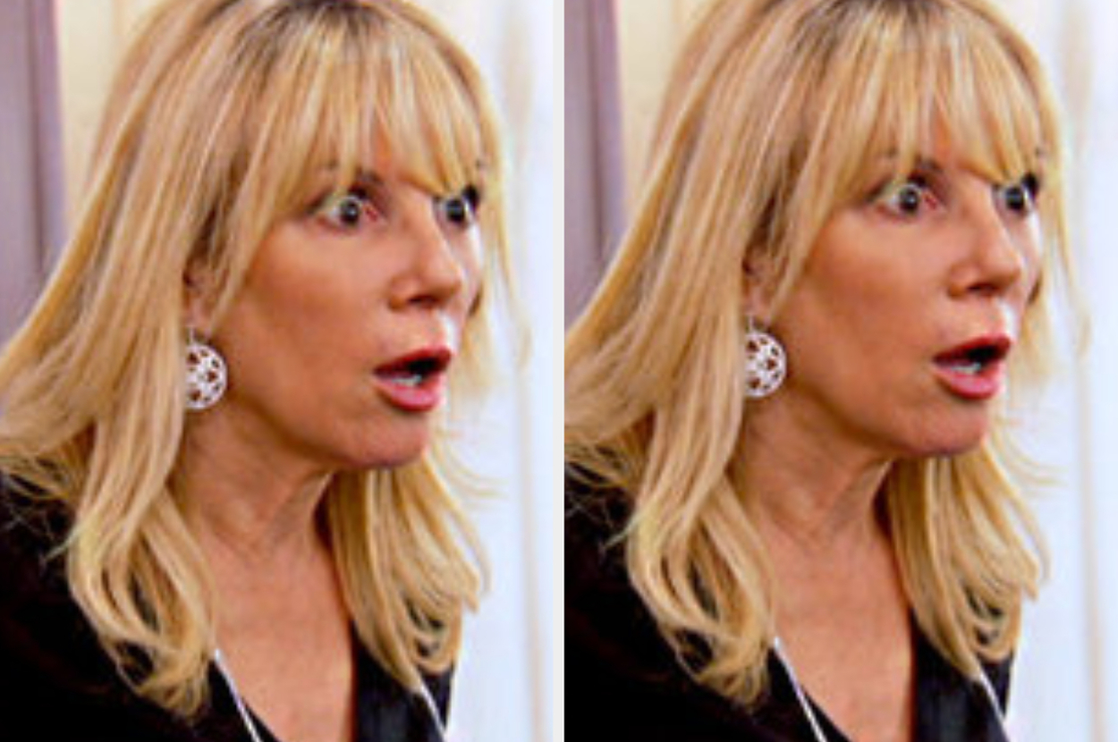 Ramona Singer with a surprised facial expression, wearing a black outfit and circular earrings