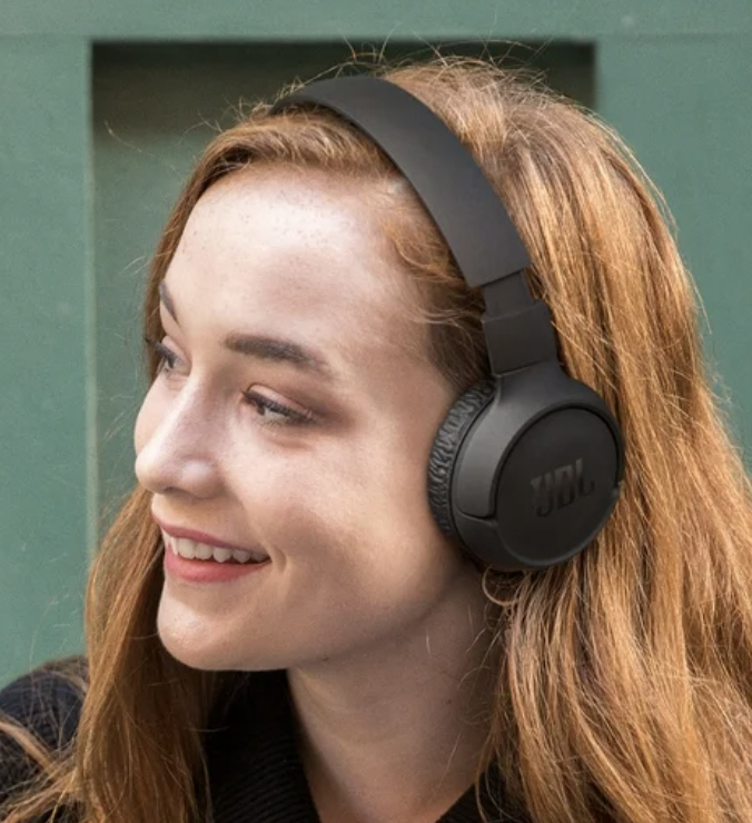 Model wearing black wireless headphones