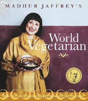 Madhur Jaffrey holding a plate of vegetarian food on the cover of her book, "World Vegetarian"