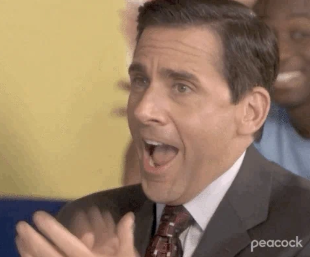 Steve Carell is clapping and looking excited