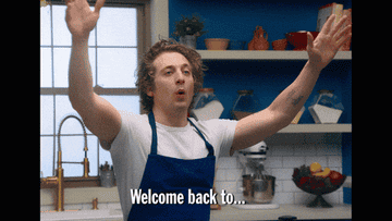 Persona rubia con delantal azul en una cocina levantando las manos. Texto dice: "Welcome back to…"