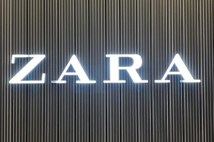 Zara store sign with vertical stripes in the background