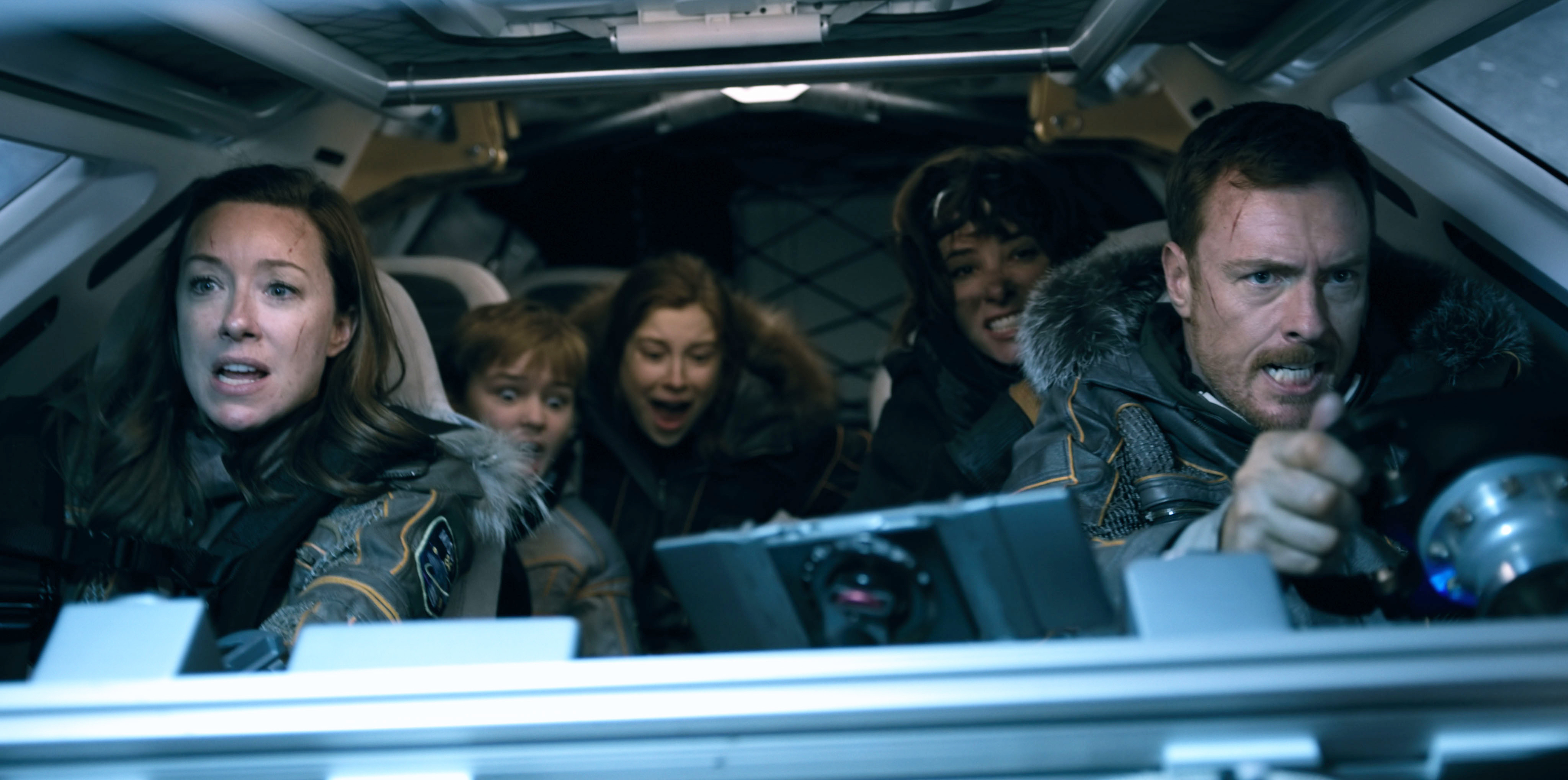 Molly Parker, Max Jenkins, Mina Sundwall, Parker Posey, and Toby Stephens in a vehicle in scene from &quot;Lost in Space&quot;