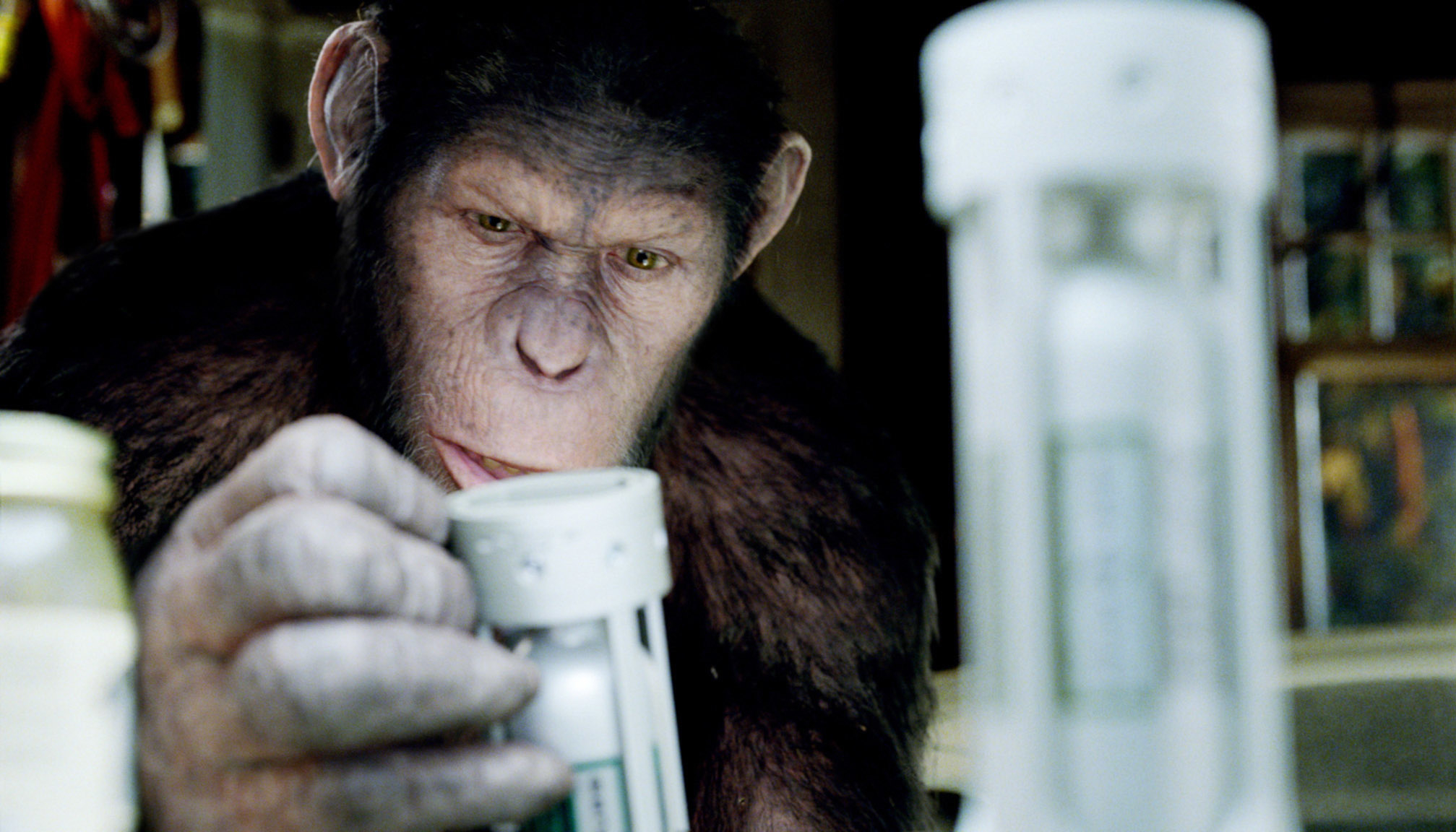 Andy Serkis as an ape examining test tubes in &quot;Rise of the Planet of the Apes&quot;