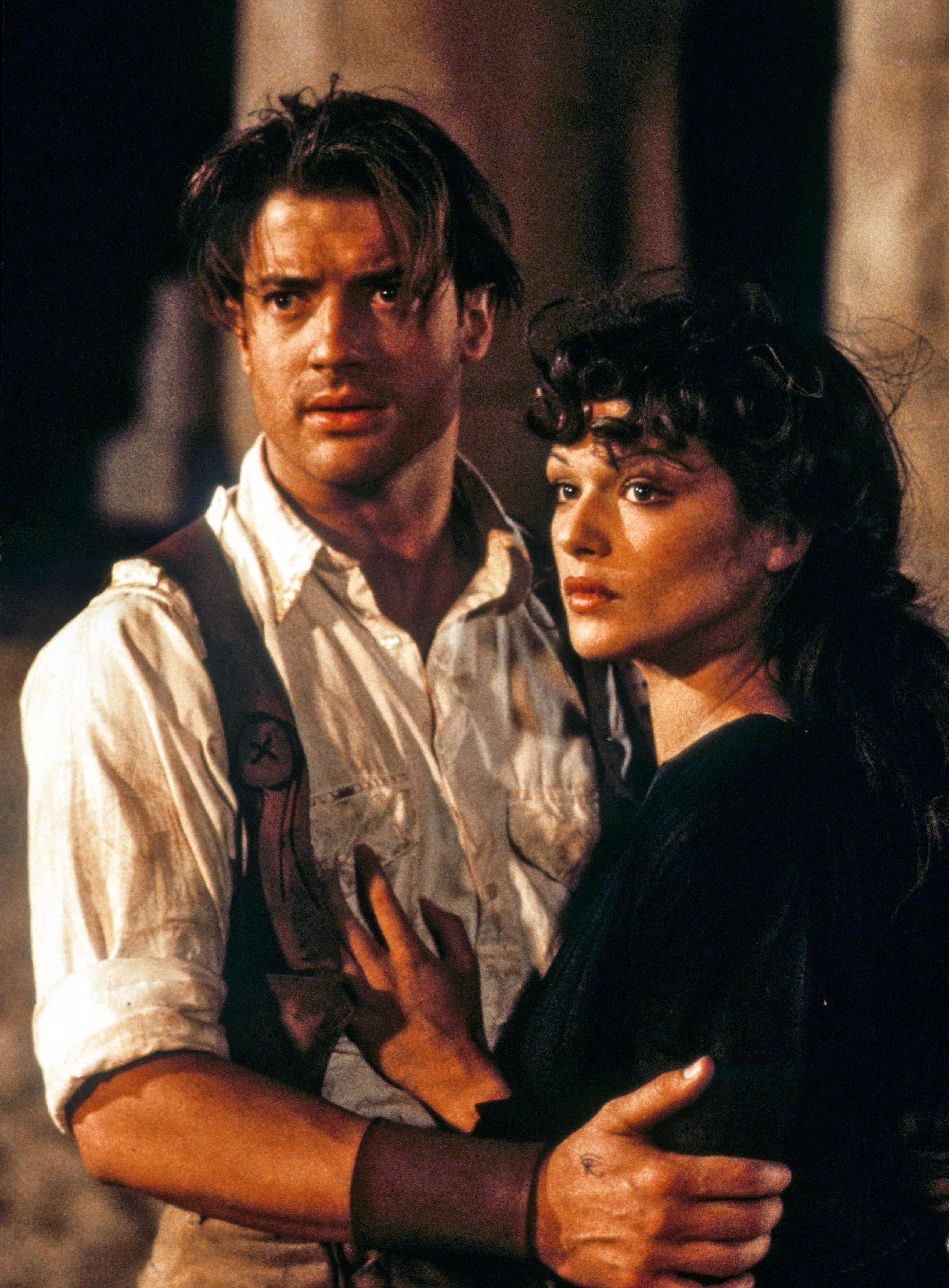 Brendan Fraser and Rachel Weisz embracing in a scene from &quot;The Mummy&quot;