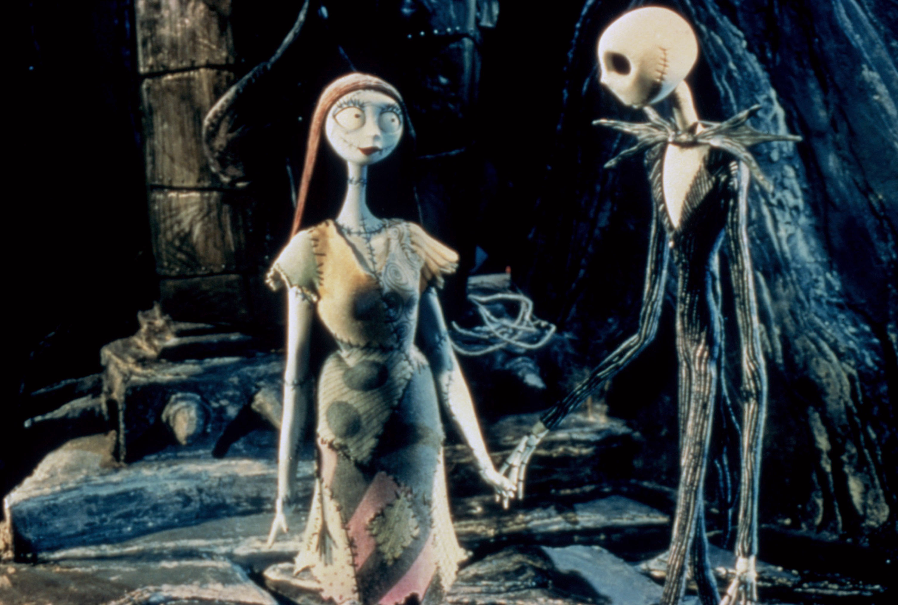 Sally and Jack Skellington standing and holding hands in "The Nightmare Before Christmas"