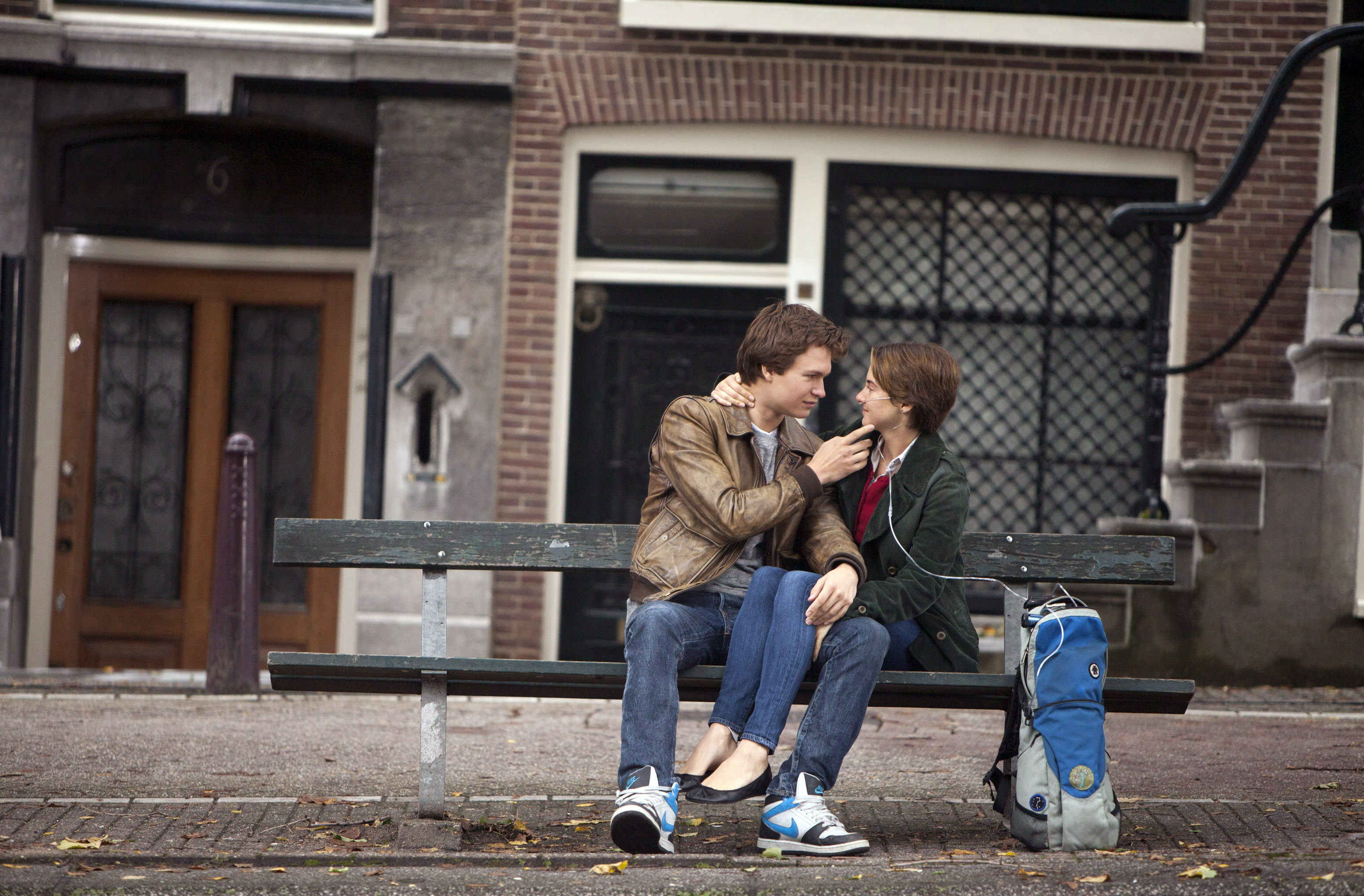 Ansel Elgort and Shailene Woodley sit on a bench in a scene from "The Fault in Our Stars"