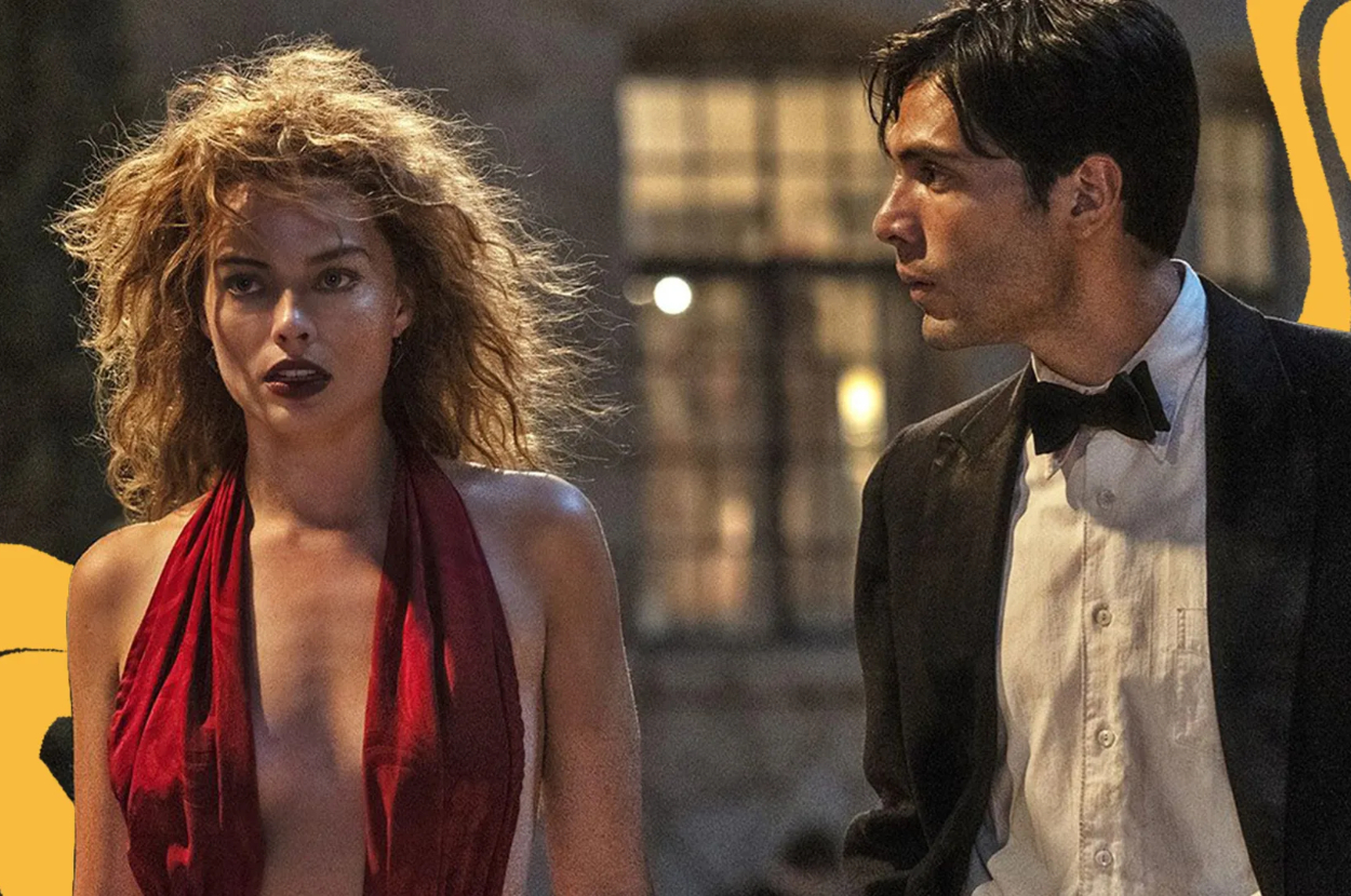 Margot Robbie in a red plunging dress and Diego Calva in a black tuxedo, appearing in a scene from a movie