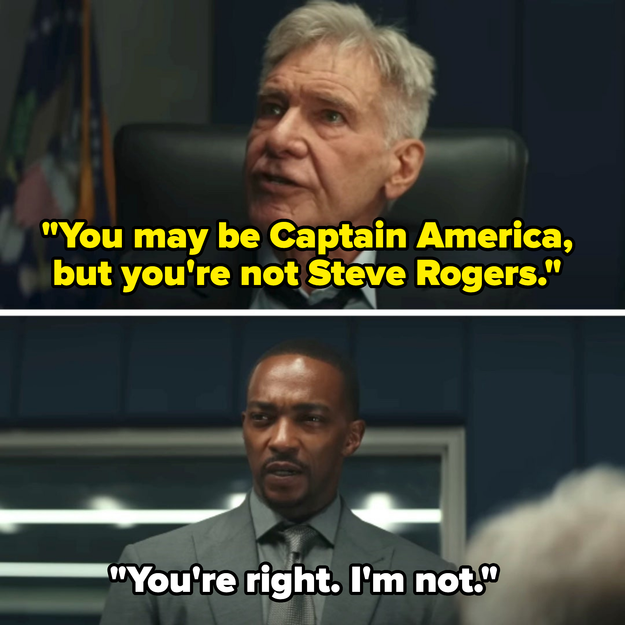 Harrison Ford and Anthony Mackie in a tense scene from a TV show or movie, both in formal business attire