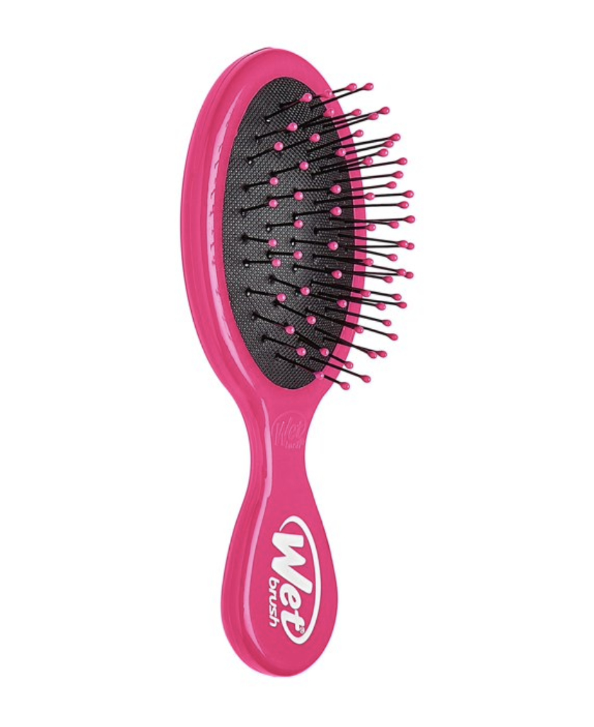 A pink Wet Brush with black bristles and pink tips, designed for easy detangling and gentle on hair