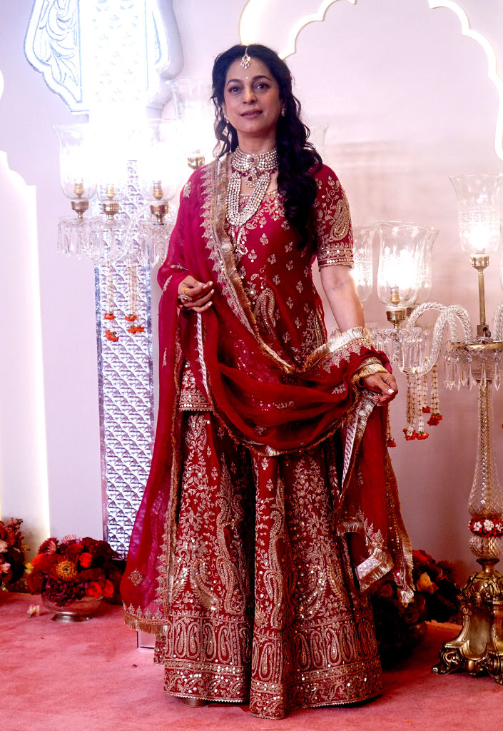 Juhi Chawla poses in a traditional intricate lehenga with detailed embroidery at a formal event