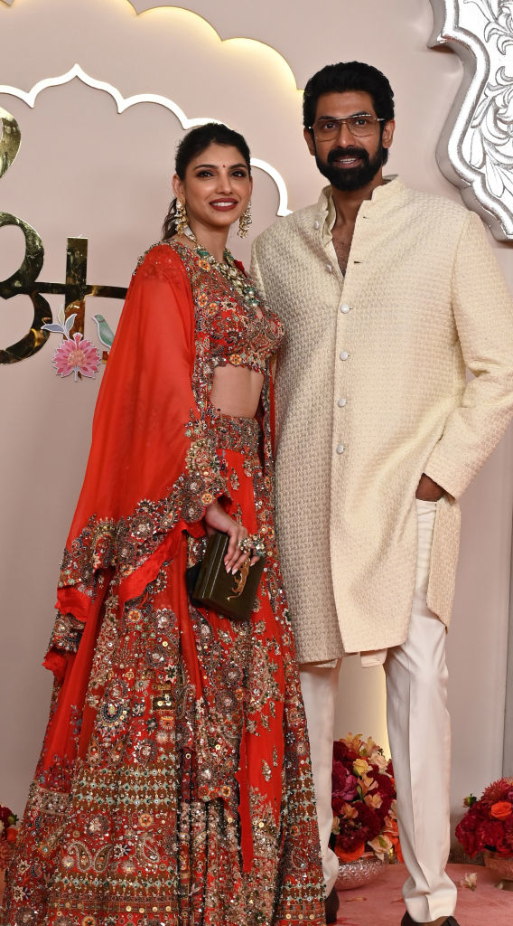 Miheeka Bajaj and Rana Daggubati at a celebrity event. Miheeka wears an ornate traditional outfit, while Rana sports a classic light-colored sherwani