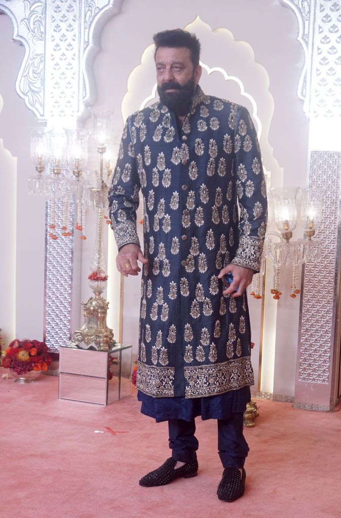 Sanjay Dutt on a red carpet in an elaborately patterned sherwani and embroidered shoes