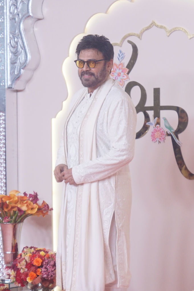 Daggubati Venkatesh in traditional sherwani with scarf on red carpet, smiling at the camera