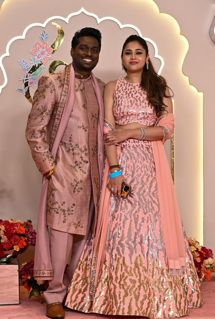 Atlee and Krishna on the red carpet, in traditional embroidered attire, posing for the cameras
