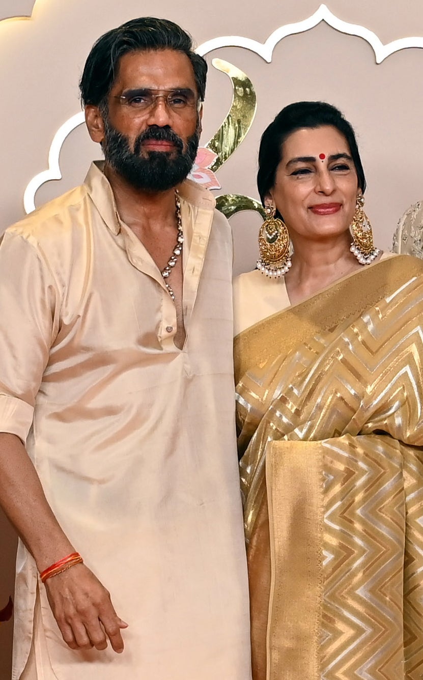 Sunil in a light outfit and Mana in a metallic outfit