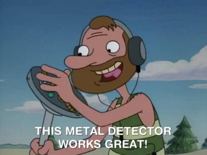 A cartoon character using a metal detector says, "THIS METAL DETECTOR WORKS GREAT!"