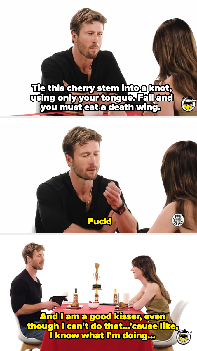 Glen Powell and Daisy Edgar Jones participate in a challenge at a table, attempting to tie a cherry stem with their tongues while eating hot wings