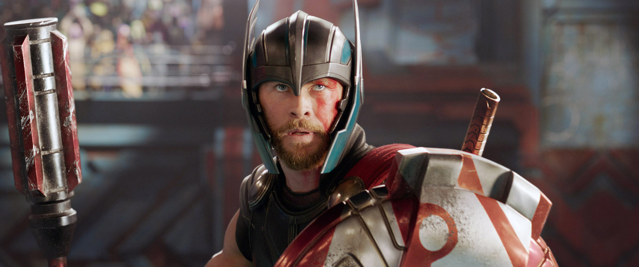 Chris Hemsworth dressed as Thor, wearing a helmet and armor, in a scene from "Thor: Ragnarok"