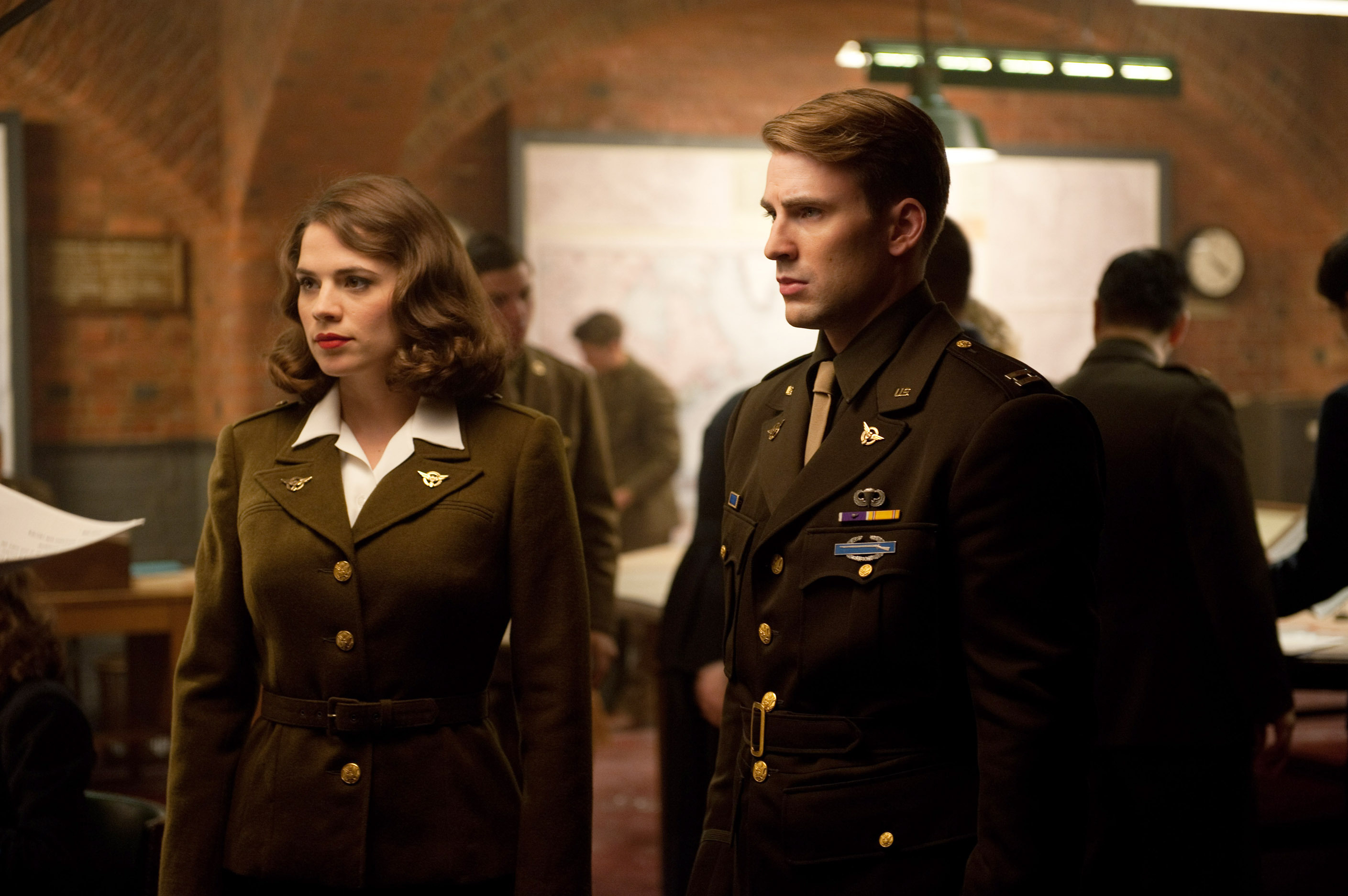 Hayley Atwell, Chris Evans in military uniforms in a scene from &quot;C...