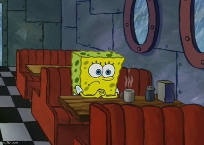 SpongeBob SquarePants sits alone in a diner booth, looking sad with clasped hands, staring at a steaming cup of coffee