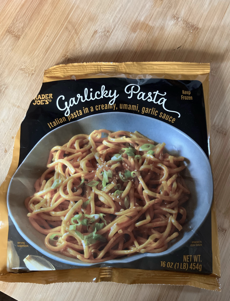Trader Joe's Garlicky Pasta package. The label reads &quot;Italian pasta in a creamy, umami, garlic sauce.&quot; The package is 16 oz (1 lb) 454g