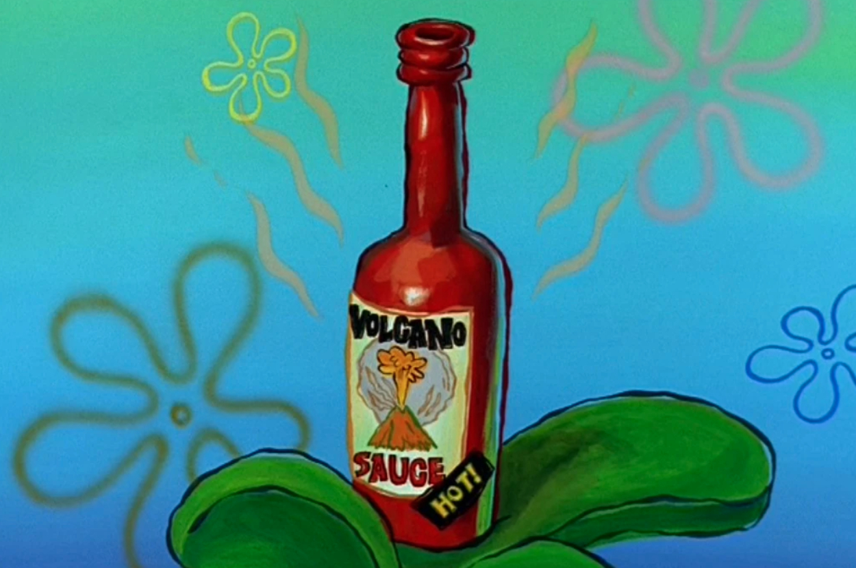 A cartoon image of a red bottle labeled &quot;Volcano Sauce&quot; with &quot;HOT!&quot; at the bottom, surrounded by green leaves and set against a lively patterned background
