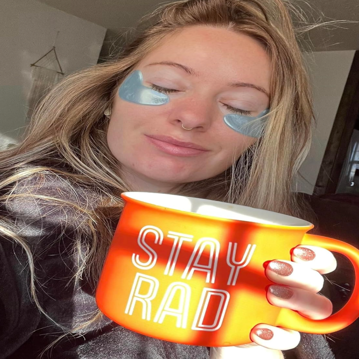 reviewer wearing blue under eye masks