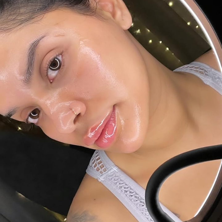 reviewer's glowing skin after using cleansing oil