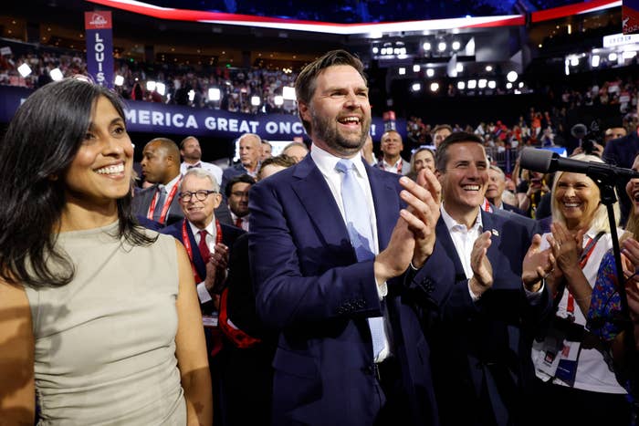 J.D. Vance and supporters applaud at a celebratory event with a large crowd, featuring a banner reading "AMERICA GREAT ONC_E."