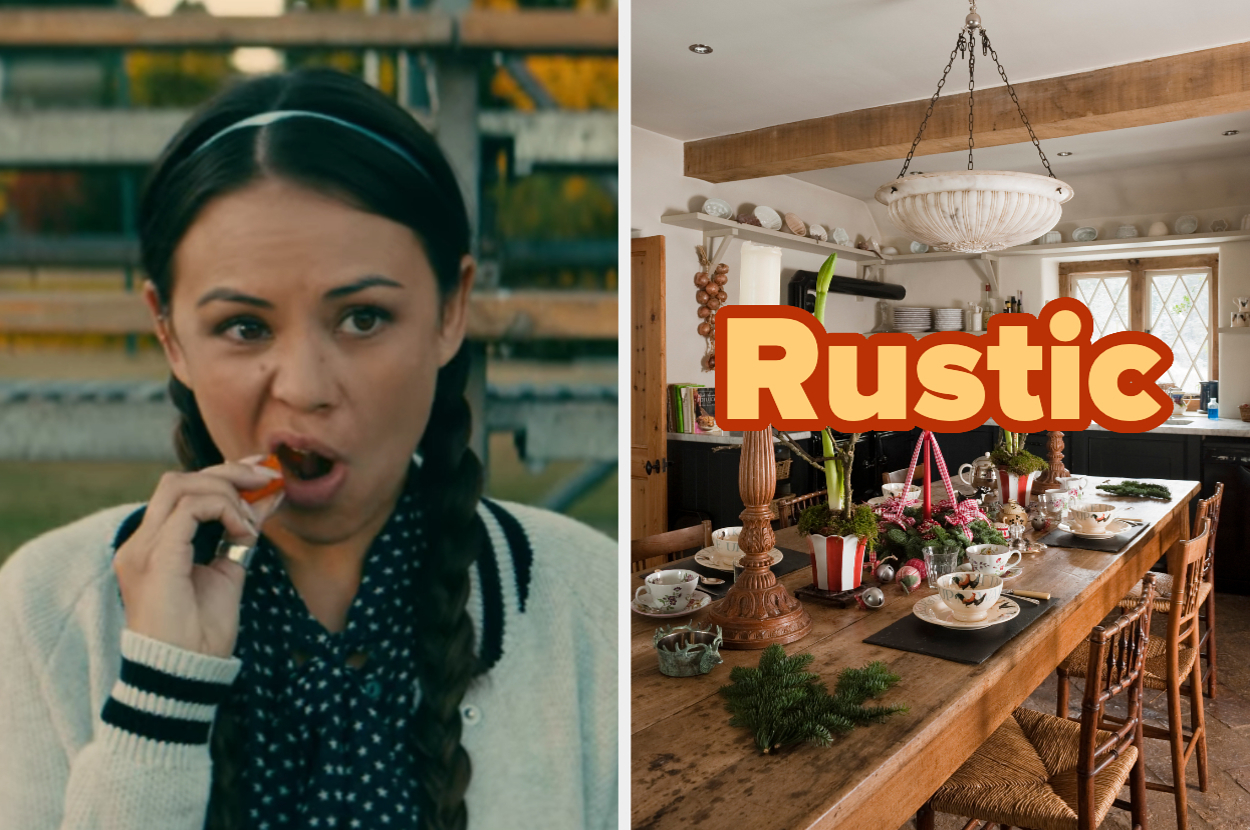 Woman eating carrot, hair in braids. Rustic dining room with wooden table, holiday decor, and large chandelier